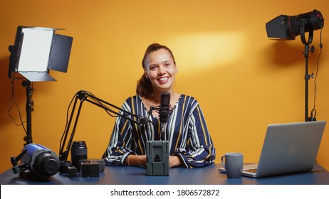 Influencer Talking About Professional Video Equipment In Her Studio Set. Professional Videography Gear Review By Content Creator New Media Star Influencer On Social Media.