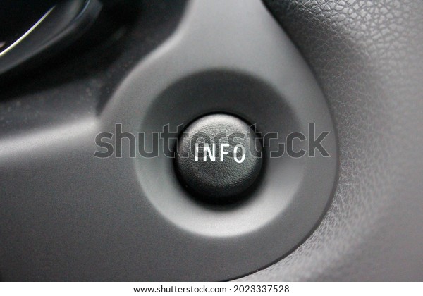 INFO button on a car\
dashboard