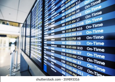 info of flight on billboard in airport - Shutterstock ID 359893316
