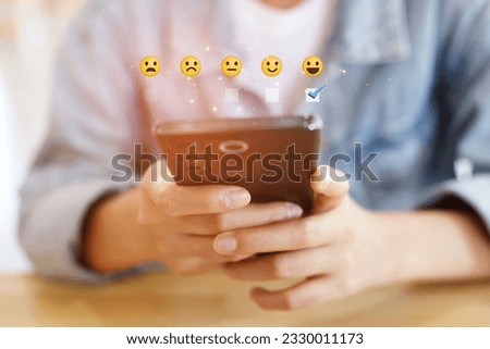 Similar – woman using smartphone sending emojis.