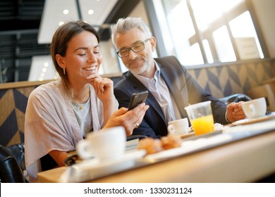 Informal breakfast meeting between salesman and manager - Powered by Shutterstock