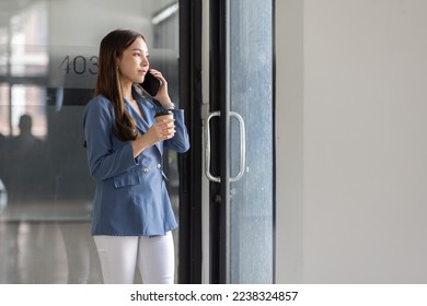 Informal Call Portrait of Happy young Asian woman in office calling her friend, talking and asking about something,  - Shutterstock ID 2238324857