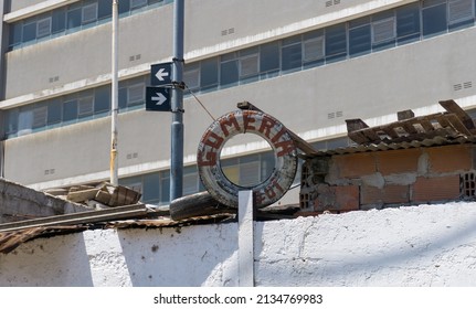 An Informal Tire Shop In Argentina, Just Under Signs With Streets With No Name