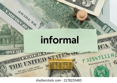 Informal.The Word Is Written On A Slip Of Paper,on Colored Background. Professional Terms Of Finance, Business Words, Economic Phrases. Concept Of Economy.