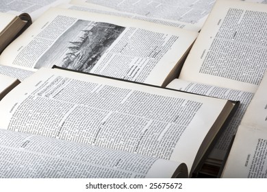 Information and knowledge concept background formed of multiple open old encyclopaedia