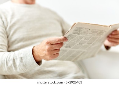 Information, People And Mass Media Concept - Close Up Of Senior Man Reading Newspaper