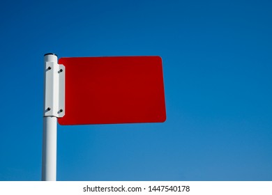 Information pointer on a single support. The screen is red.  There is no inscription on the screen. The background of the image is blue. Copy space.