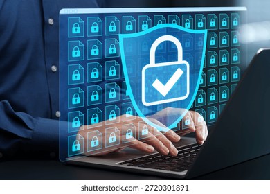 Information security and file encryption system. Secure data storage. Businessman using laptop computer with data protection system.