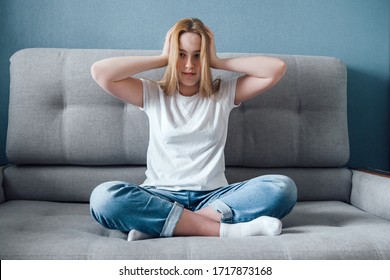 Informational Digital Detox. Fake News. A Girl In Stress And Anxiety Of Depression Closed Her Ears. He Does Not Hear False Information About The Corona Virus Covid 19.