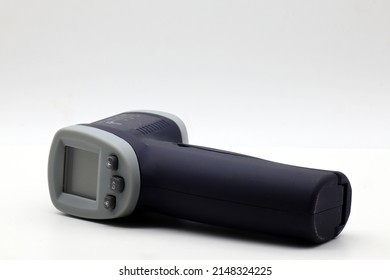 Infrared Laser Thermometer Isolated On White. It Measures Temperature Without Contact.