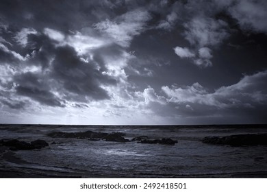 Infrared seascape with a dramatic cloudy sky 