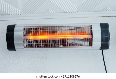 Infrared wall heater for cold winter days - Shutterstock ID 1911109276