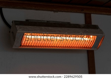 Infrared wall heater for cold winter days. High quality photo