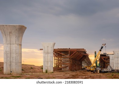 Infrastructure Construct Concepts, Construction Of Highway Line In Progress With Heavy Infrastructure, , Bridge Construction Site With Crane Lifting Prefabricated Concrete Framework