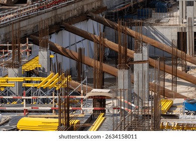 Infrastructure Project: Overview of a Large Structure Being Built with Concrete Pillars and Metal Reinforcements