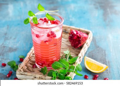 Infused Pomegranate Water With Fresh Lemon And Ice, Cold Healthy Refreshing And Detox Drink