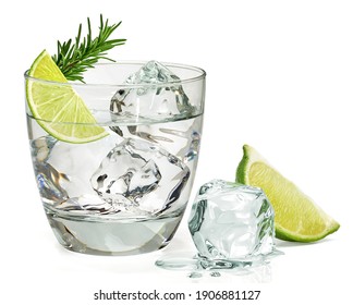 Infused rosemary vodka or gin tonic with sliced lime in glass isolated on white background.