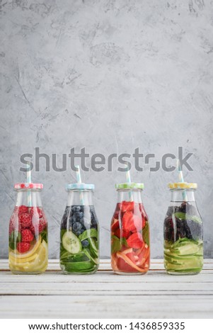 Similar – Flaschen mit Wasser ,Obst , Beeren and Kräutern