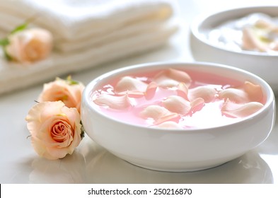 Infused Water With Rose Petals In A White Bowl