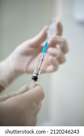 Infusion Syringe In The Hands Of A Nurse. Selective Focus