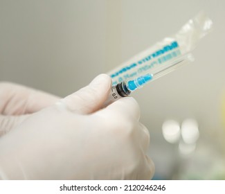 Infusion Syringe In The Hands Of A Nurse. Selective Focus