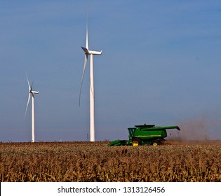 Ingalls, Kansas, USA, October 23, 2014
A John Deere Combine Sends Its Load Of Harvested Milo Grain From It's Storage Hopper Thru It's Discharge Tube Into The Bed Of A Waiting Tractor Trailer Hauler