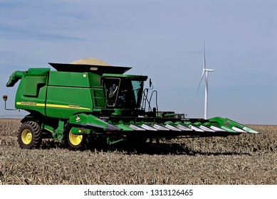 Ingalls, Kansas, USA, October 23, 2014
A John Deere Combine Sends Its Load Of Harvested Milo Grain From It's Storage Hopper Thru It's Discharge Tube Into The Bed Of A Waiting Tractor Trailer Hauler