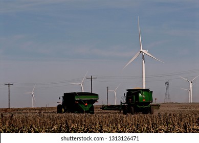 Ingalls, Kansas, USA, October 23, 2014
A John Deere Combine Sends Its Load Of Harvested Milo Grain From It's Storage Hopper Thru It's Discharge Tube Into The Bed Of A Waiting Tractor Trailer Hauler