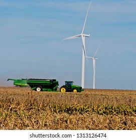 Ingalls, Kansas, USA, October 23, 2014
A John Deere Combine Sends Its Load Of Harvested Milo Grain From It's Storage Hopper Thru It's Discharge Tube Into The Bed Of A Waiting Tractor Trailer Hauler