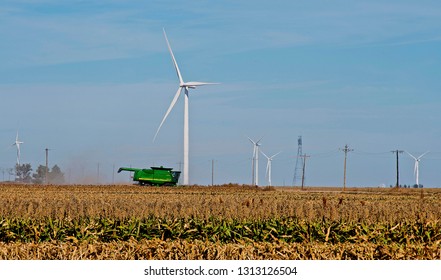 Ingalls, Kansas, USA, October 23, 2014
A John Deere Combine Sends Its Load Of Harvested Milo Grain From It's Storage Hopper Thru It's Discharge Tube Into The Bed Of A Waiting Tractor Trailer Hauler