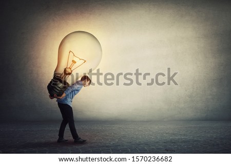 Ingenious student guy carrying a big light bulb on his back. Overloaded businessman needs a brilliant idea for solving a difficult task. Success achieving concept.