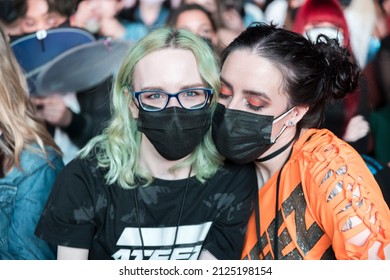 Inglewood, California, USA - January 31, 2022 - Fans Of The South Korean Kpop Group ATEEZ Pose With Striking Eyes At The LA Forum.