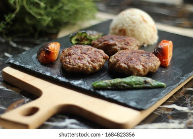 Ingole Kofte With Ground Beef With Mints, Tomato And Rice On A Slider Platter