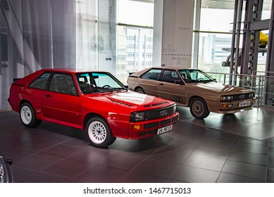 Ingolstadt, Germany - April 9, 2019: Two Audi Quattro 1980s cars: 'Sport Quattro' rare rally Group B homologation 1984 racing car in red and an usual road Audi Quattro serial production car.