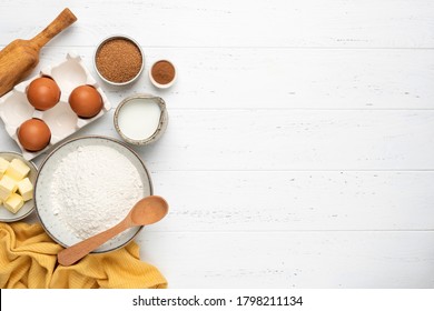 Ingredients For Baking A Cake Cookies Or Sweet Pastry On White Wooden Table Background