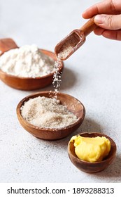 
Ingredients For Baking Are Flour, Margarine And Flying Sugar Using A Wooden Spoon