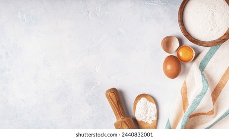 Ingredients for baking  - flour, wooden spoon, rolling pin, eggs. Top view, copy space. - Powered by Shutterstock