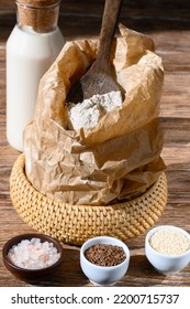 Ingredients For Baking And Milk Bottle On Dark Wooden Table Side View