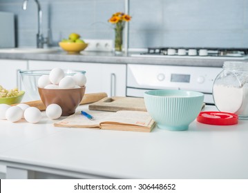 ingredients for baking and recioe book on a kitchen table - Powered by Shutterstock