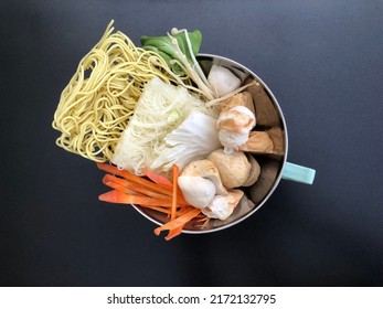 Ingredients Of Chinese Steamboat Hot Pot Food On Black Table