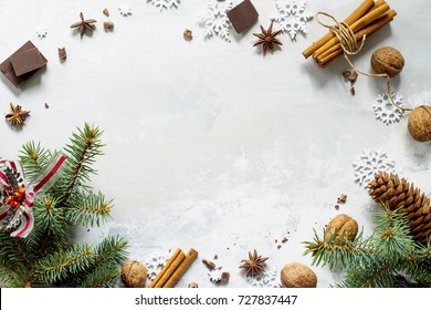 Ingredients For Christmas Baking - Chocolate, Cinnamon, Anise And Nuts On A Stone Or Slate Background. Seasonal, Food Background.