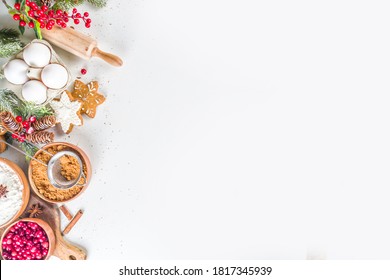 Ingredients For Christmas Cooking, Winter Baking Cookies, Gingerbread, Fruitcake, Seasonal Drinks. Cranberries, Dried Oranges, Cinnamon, Spices, Flour On White Table, Copy Space Top View