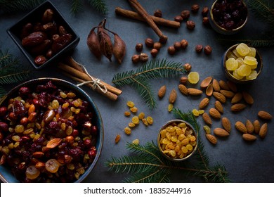 Ingredients For Christmas Fruit Cake  (nuts And Dried Fruits). Nuts And Soft Fruits Soaking Up Added Brandy In The Ceramic Bowl. Top View.