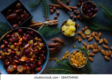 Ingredients For Christmas Fruit Cake  (nuts And Dried Fruits). Ceramic Bowl With Nuts And Soft Fruit Soaked In Brandy. Top View.
