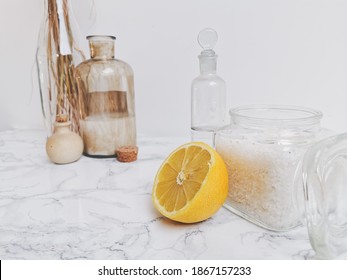 Ingredients For Eco-friendly Homemade Cleaning Products And Laundry Detergent Such As Essential Oil, Lemon, Vinegar And Soda Crystals