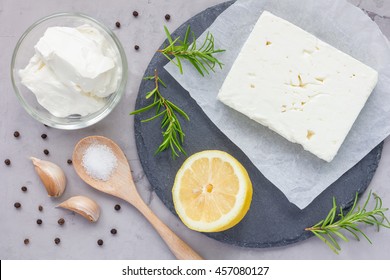 Ingredients For Feta, Cream Cheese, Rosemary, Lemon And Garlic Dip On Slate Board, Top View