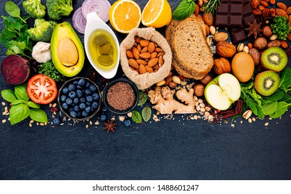 Ingredients for the healthy foods selection. The concept of healthy food set up on dark stone background. - Shutterstock ID 1488601247