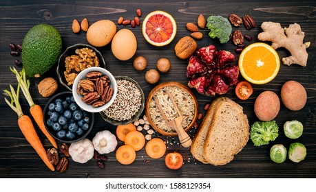 Ingredients for the healthy foods selection. The concept of healthy food set up on wooden background. - Shutterstock ID 1588129354