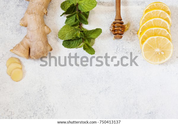Ingredients for herbal medicine lemon, ginger, mint, honey. Natural products to support the immune system in winter, top view with place for text