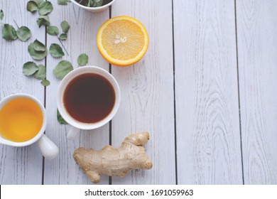 Ingredients For Immune Boosting Tea- Herbs, Ginger, Orange, Honey And Rosehips Berries. Immunity Support To Prevent Coronavirus Infection. Top View. Copy Space.